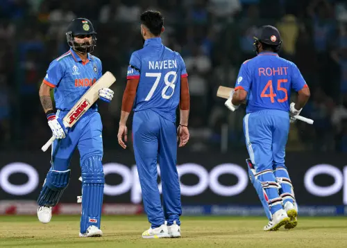 India's Rohit Sharma and Virat Kohli run between the wickets during the ICC Men's Cricket World Cup 2023 match between India and Afghanistan, at Arun Jaitley Stadium, in New Delhi, Wednesday, Oct. 11, 2023 | Photo: PTI