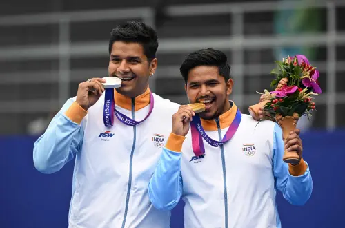 Gold medallists India's Ojas Pravin Deotale (R) and silver medallist India's Abhishek Verma (L) pose during the medal ceremony for the archery compound men's individual event during the 2022 Asian Games in Hangzhou in China's eastern Zhejiang province on October 7, 2023. AFP