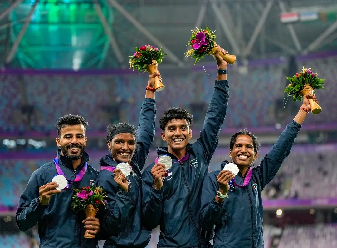 Silver medallist India's Muhammed Ajmal Variyathodi, Subha Venkatesan, Vithya Ramraj and Rajesh Ramesh pose for photos during the presentation ceremony of 4x400 Relay Mixed final event at the 19th Asian Games | Photo: PTI