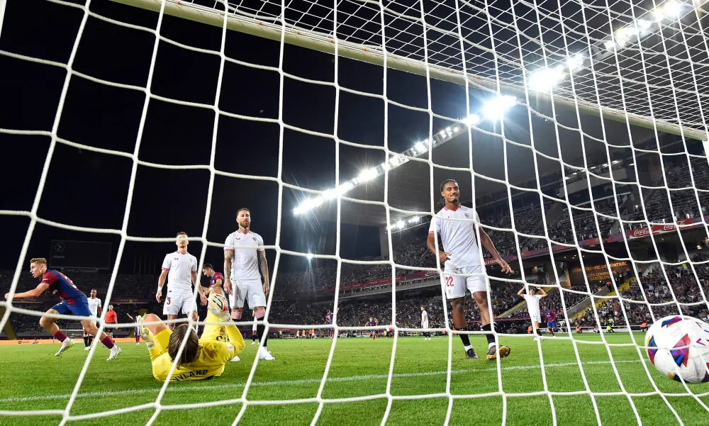 Fermin Lopez (L) celebrates  Sergio Ramos' owngoal | AFP