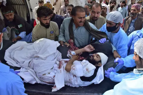 At least 58 people killed in two suicide blasts in Pakistan