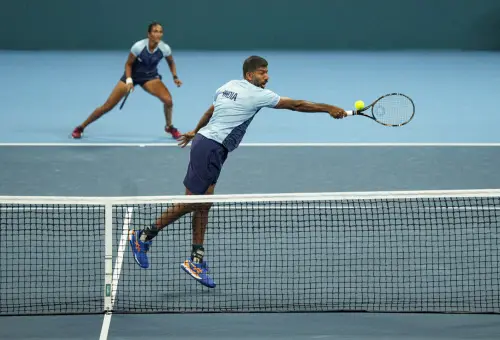 India's Rohan Bopanna and Rutuja Bhosale during the mixed doubles quarterfinal tennis match against Kazakhstan's Grigoriy Lomakin and Zhibek Kulambayeva at the 19th Asian Games, in Hangzhou, China, Thursday, Sept. 28, 2023 | Photo: PTI