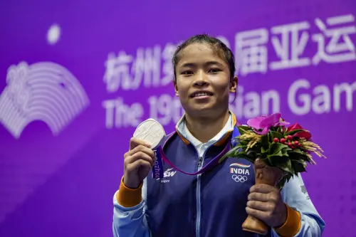 Hangzhou: India's Naorem Roshibina Devi with her silver medal poses for photographs during presentation ceremony of the Women's 60 kg Wushu event at the 19th Asian Games, in Hangzhou, China, Thursday, Sept. 28, 2023. (PTI Photo/Gurinder Osan)