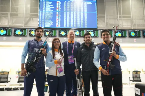Hangzhou: Indian shooters Rudrankksh Patil (R) and Aishwary Pratap Singh Tomar (2nd R) and Divyansh Singh Panwar with coach and support staff after shooting down gold in team event with a world record score in men's 10m Air Rifle event at the 19th Asian Games, in Hangzhou, China, Monday, Sept. 25, 2023.