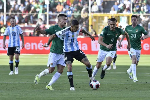 Argentina's forward Angel Di Maria fights for the ball with Bolivia's midfielder Moises Villarroel during the 2026 FIFA World Cup South American qualifiers football match between Bolivia and Argentina, at the Hernando Siles stadium in La Paz, on September 12, 2023. (Photo by AIZAR RALDES / AFP)