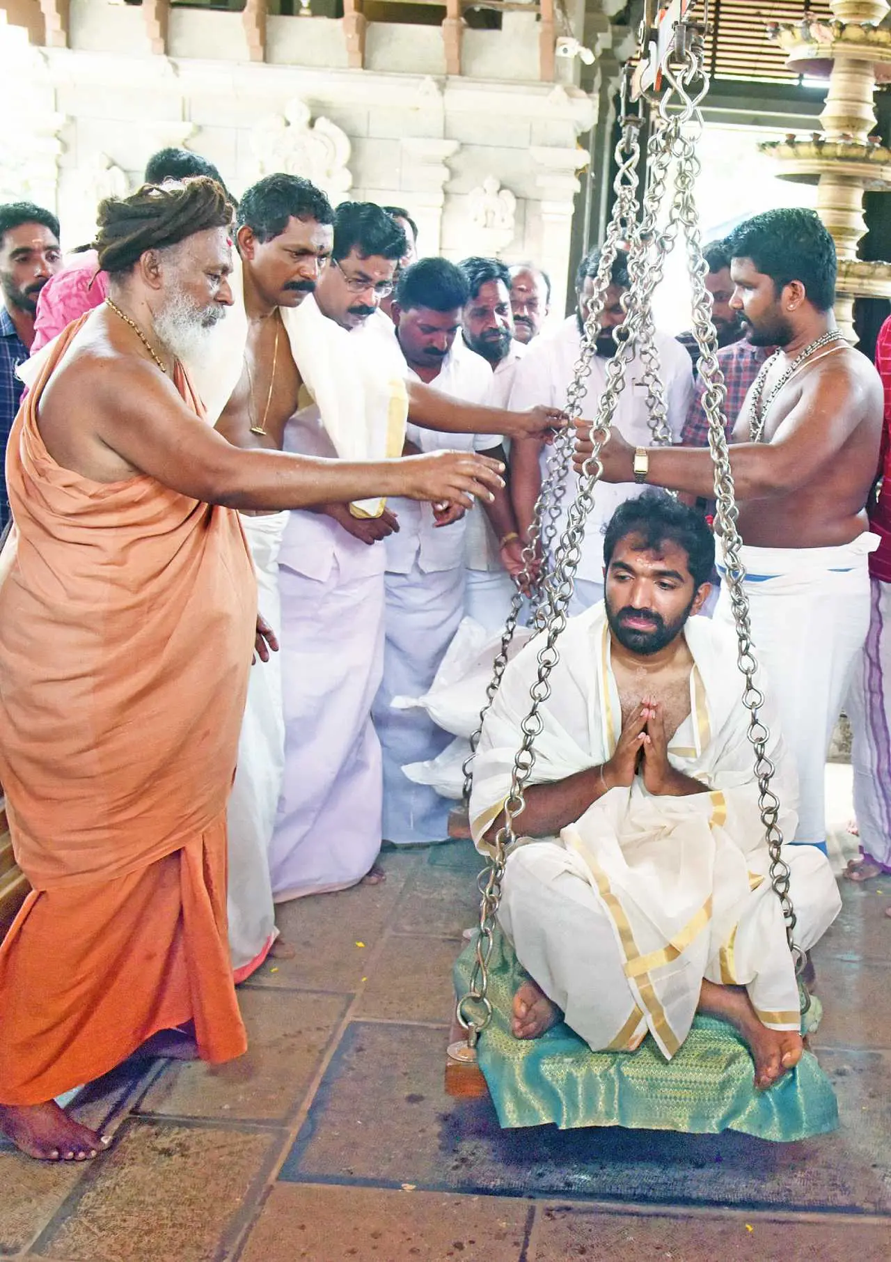 Chandy Oommen offering 'thulabharam' at Chenkal Maheshwaram Shiva Parvathi temple on Sunday.
