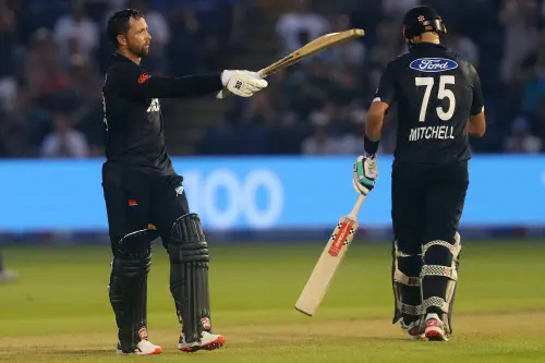 New Zealand's Devon Conway celebrates his 100 runs during the first One Day International cricket match between England and New Zealand at Sophia Gardens in Cardiff, south Wales on September 8, 2023. (Photo by Geoff Caddick / AFP)