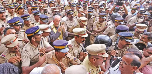 Police officers make a human shield to protect papal delegate Archbishop Cyril Vasil from protesters when he entered Ernakulam St Mary's Basilica | Photo: Mathrubhumi/TK Pradeep Kumar