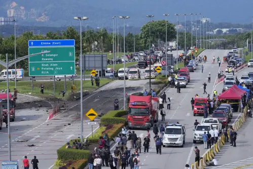 Small plane crashes on a Malaysian highway, killing all 8 people on board and 2 on the ground
