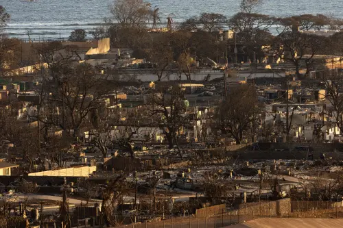 Burned houses and buildings are pictured in the aftermath of a wildfire, is seen in Lahaina, western Maui, Hawaii on August 12, 2023. Hawaii's Attorney General, Anne Lopez, said August 11, she was opening a probe into the handling of devastating wildfires that killed at least 80 people in the state this week, as criticism grows of the official response. The announcement and increased death toll came as residents of Lahaina were allowed back into the town for the first time. (Photo by Yuki IWAMURA / AFP)