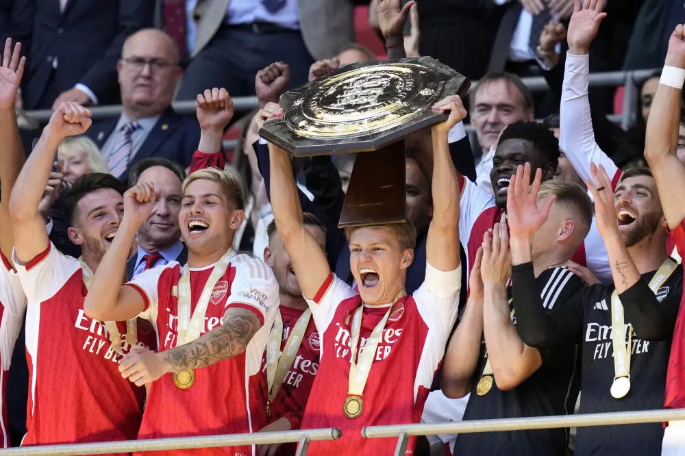 Martin Odegaard holds up the trophy after winning the English FA Community Shield | AP