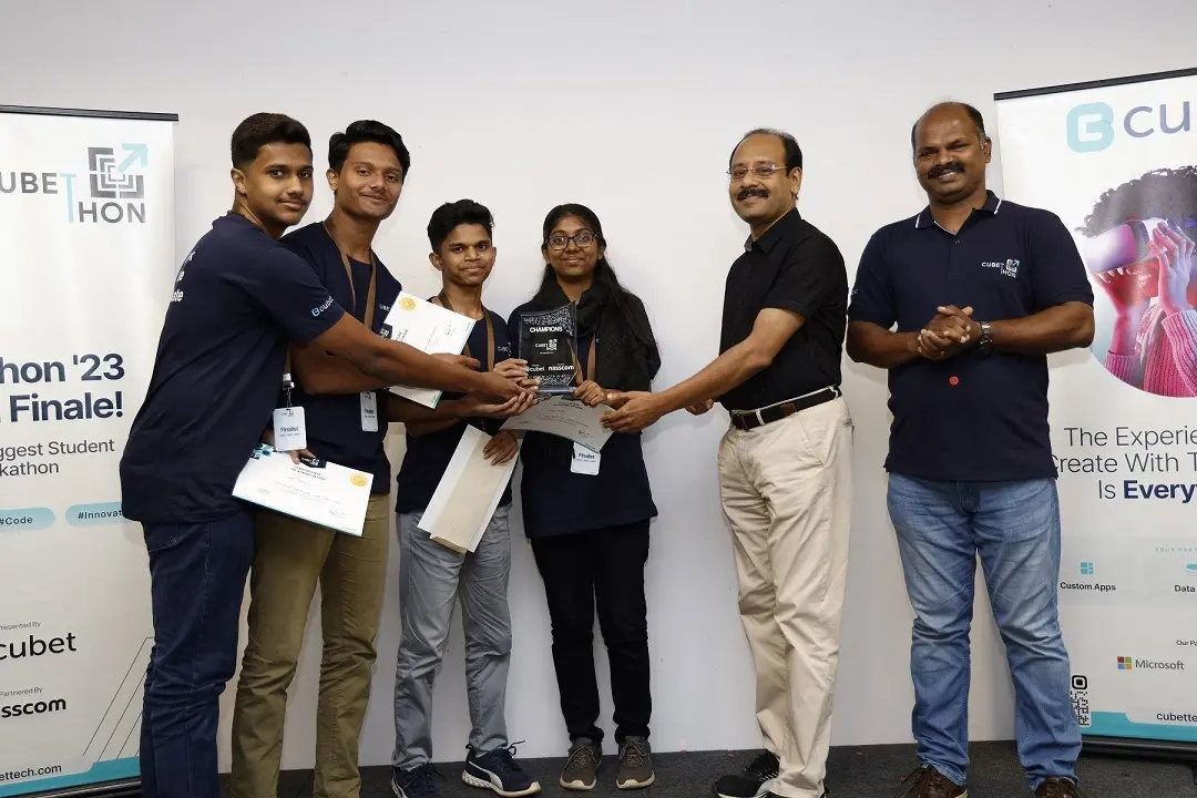 The champion team from Govt. Model Engineering College receives the cash prize and certificates from Mr Sushanth Kurunthil, CEO Infopark and Lovegin John, CEO Cubet.