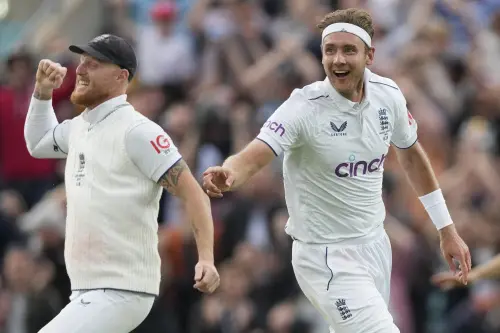 England's Stuart Broad and England's Ben Stokes celebrate the dismissal of Australia's Todd Murphy on day five of the fifth Ashes Test match between England and Australia, at The Oval cricket ground in London, Monday, July 31, 2023. (AP Photo/Kirsty Wigglesworth)