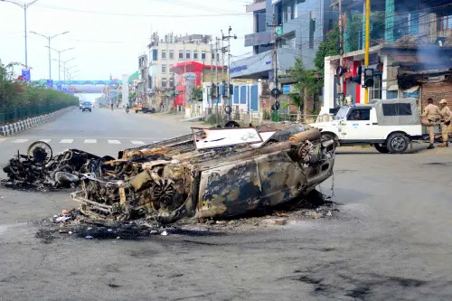 This picture taken on May 4, 2023, shows vehicles allegedly burned by the Meitei community tribals protesting to demand inclusion under the Scheduled Tribe category, in Imphal the capital of India's Manipur state | Photo: AFP