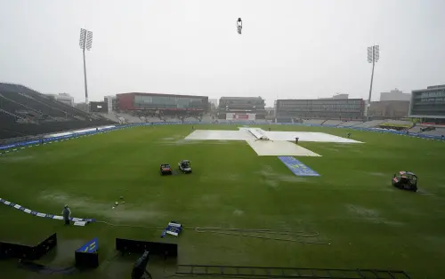 Rain covers are laid out on the pitch the fifth day of the fourth Ashes Test match between England and Australia at Old Trafford, Manchester, England, Sunday, July 23, 2023. The match was later abandoned due to the rain. (Martin Rickett/PA via AP)