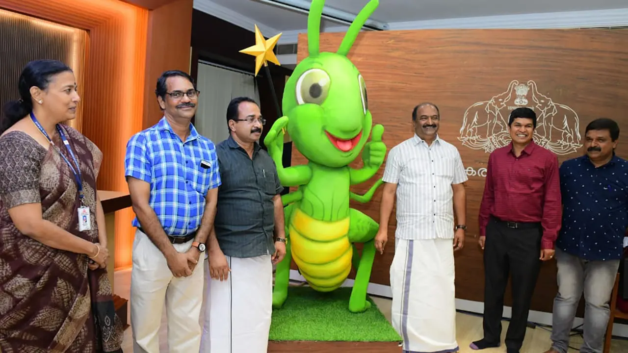 KN Balagopal with Lottery Department's new mascot