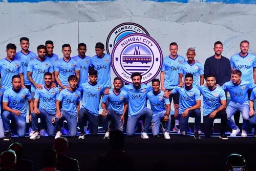 Mumbai: Mumbai City FC Co-owner and actor Ranbir Kapoor poses for a group photo with players during a press conference for the unveiling of the football club's new crest and logo, in Mumbai, Friday, 14 July 2023. (PTI Photo)