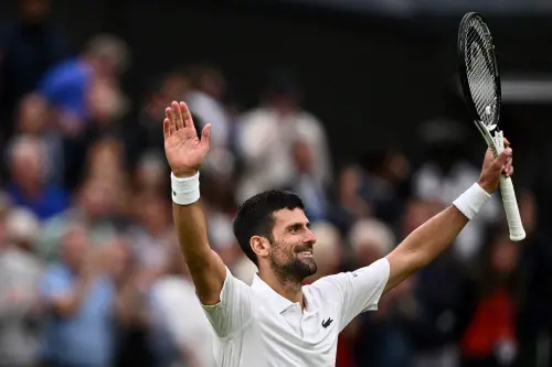 Serbia's Novak Djokovic celebrates winning against Italy's Jannik Sinner during their men's singles semi-finals tennis match on the twelfth day of the 2023 Wimbledon Championships at The All England Lawn Tennis Club in Wimbledon, southwest London, on July 14, 2023 | Photo: AFP
