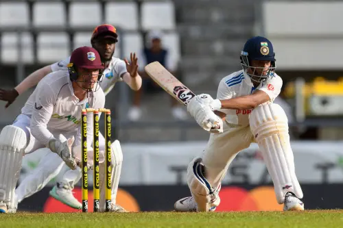 Yashasvi Jaiswal (R) of India sweeps as Joshua Da Silva (L) of West Indies watches during the 1st day of the 1st Test between West Indies and India at Windsor Park in Roseau, Dominica, on July 12, 2023. (Photo by Randy Brooks / AFP)