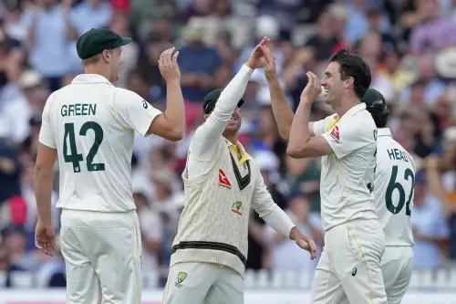 Australia's captain Pat Cummins, second right, celebrates with teammates after the dismissal of England's Harry Brook during the fourth day of the second Ashes Test match between England and Australia, at Lord's cricket ground in London, Saturday, July 1, 2023. (AP Photo/Kirsty Wigglesworth)