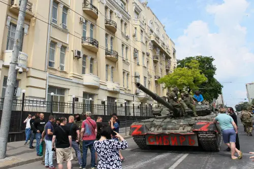 Members of Wagner group sit atop of a tank in a street in the city of Rostov-on-Don, on June 24, 2023. President Vladimir Putin on June 24, 2023 said an armed mutiny by Wagner mercenaries was a 'stab in the back' and that the group's chief Yevgeny Prigozhin had betrayed Russia, as he vowed to punish the dissidents. Prigozhin said his fighters control key military sites in the southern city of Rostov-on-Don | Photo: AFP