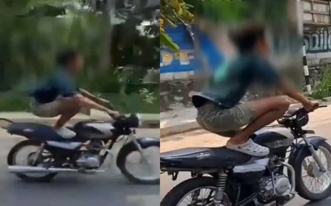 Afsal performing dangerous stunts on the road.