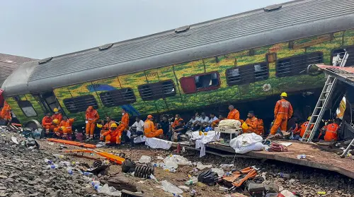 Rescue teams rest during a rescue and search operation after the train accident in Balasore district | Photo: PTI