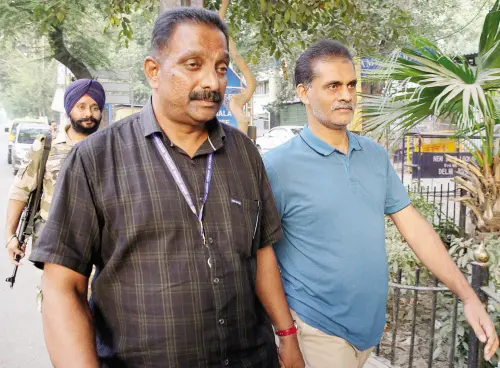 Ibrahim Puthanathani (R) being produced at court. File photo | Photo: ANI