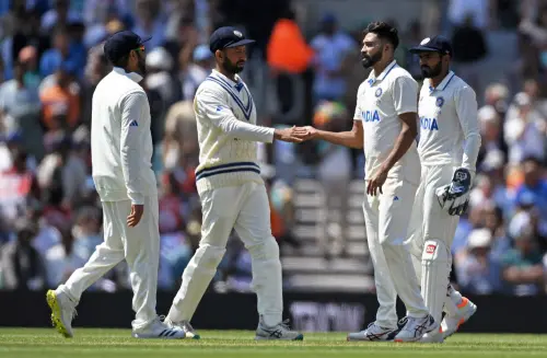 London, June 9 (ANI): India's Mohammed Siraj and Cheteshwar Pujara celebrate the dismissal of Australia's David Warner during Day three of the test match between India and Australia in the ICC World Test Championship (WTC) final, at The Oval in London on Friday. (ANI Photo)