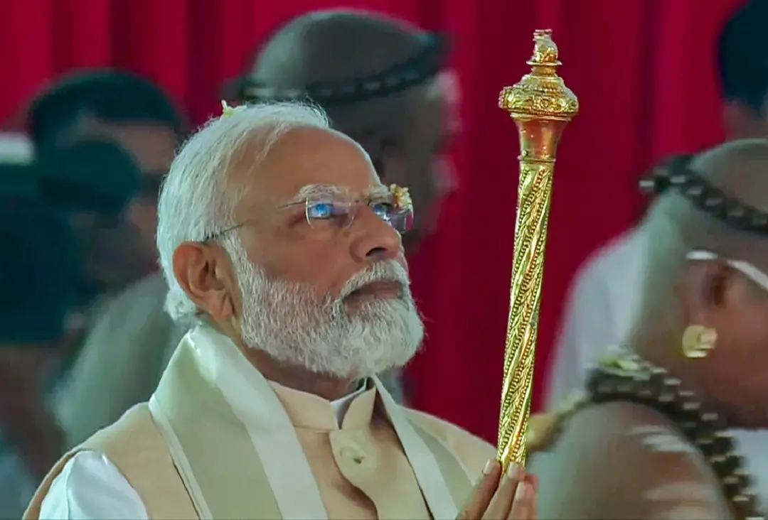 Prime Minister Narendra Modi carries the historic 'Sengol' into the Lok Sabha chamber of the new Parliament building | Photo: ANI