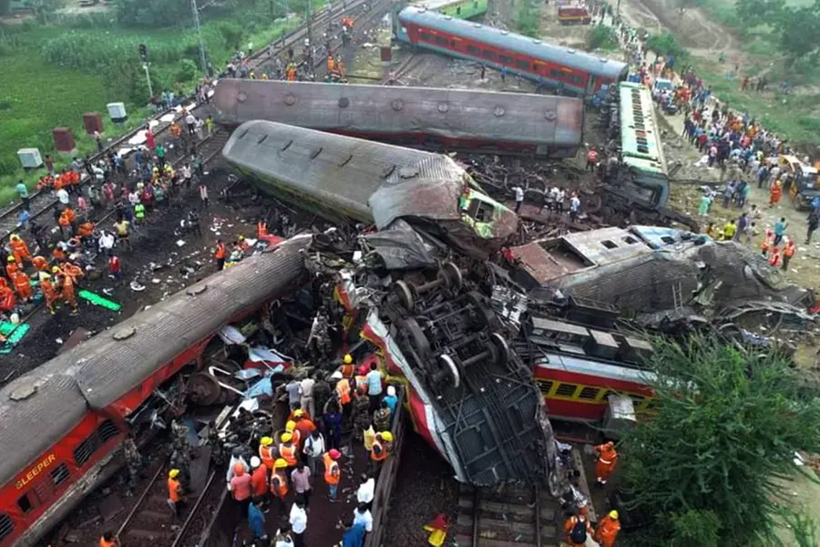 Blood-stained wreckage, debris piled high, officials search for answers