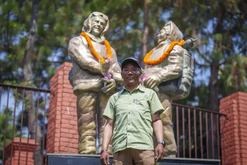 Record holder Veteran Sherpa guide Kami Rita poses for a photo in front of the statues of New Zealander Edmund Hillary, left, and his Sherpa guide Tenzing Norgay on the 70 anniversary of the first ascent of Mount Everest in Kathmandu, Nepal, Monday, May 29, 2023. The 8,849-meter (29,032-foot) mountain peak was first scaled by Hillary and Norgay on May 29, 1953 | Photo: AP/PTI