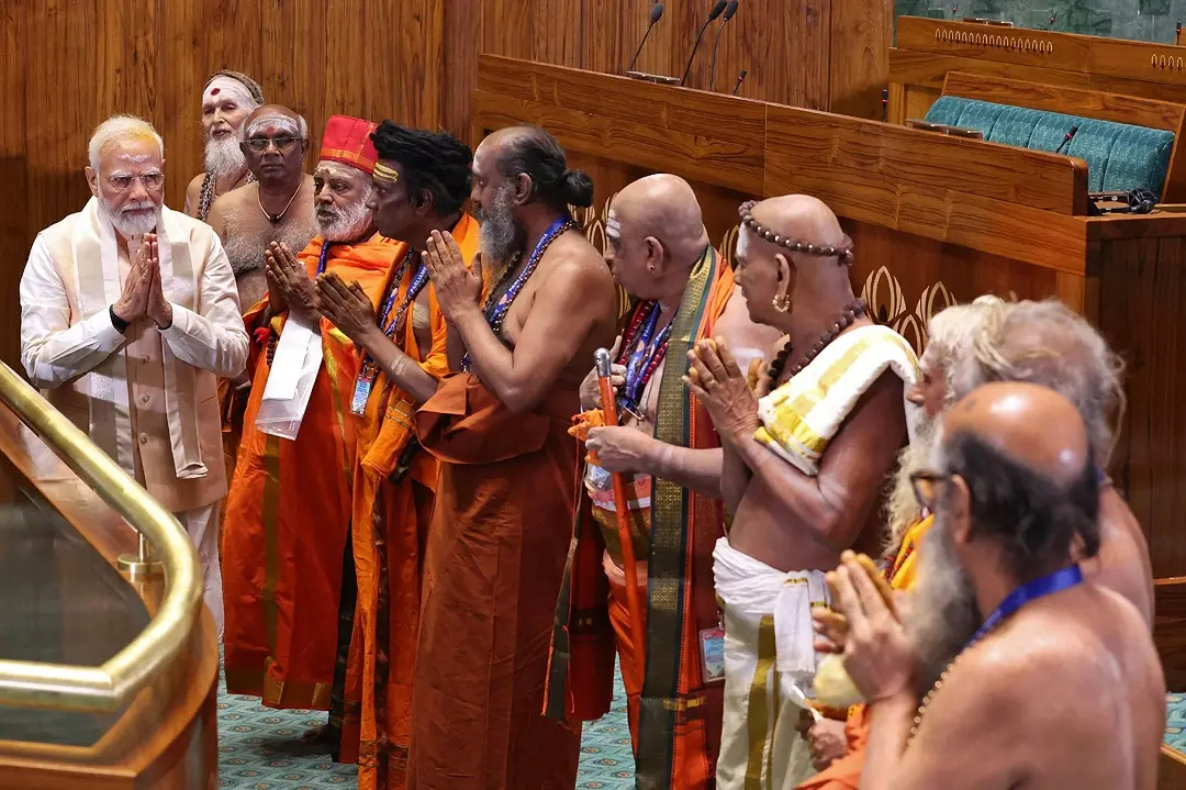 Prime Minister Narendra Modi (L) gesturing to priests during the inauguration ceremony of the new parliament building in New Delhi | Photo: PIB / AFP