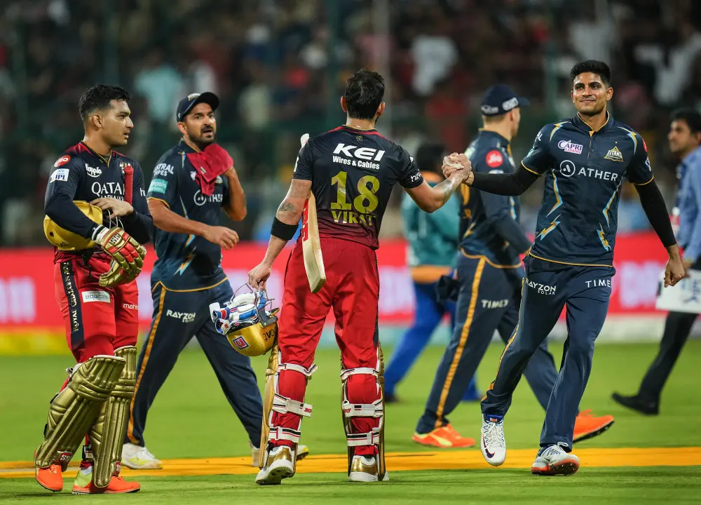 Virat Kohli being greeted by Gujarat Titans player Shubman Gill | PTI