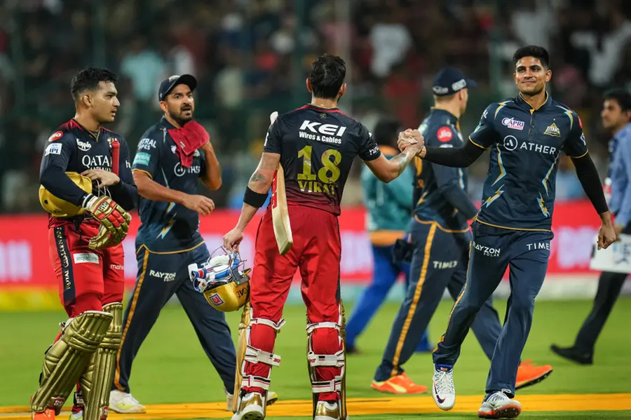 Kohli's century not enough as Bangalore eliminated from IPL, Mumbai through to playoffs