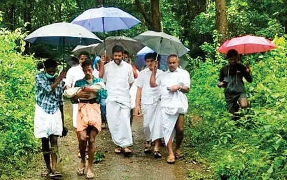 Ayyappan walking with child's mortal remains in Attappadi