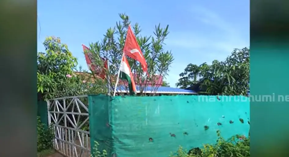 The visual of the flags hoisted at CPM leader's house