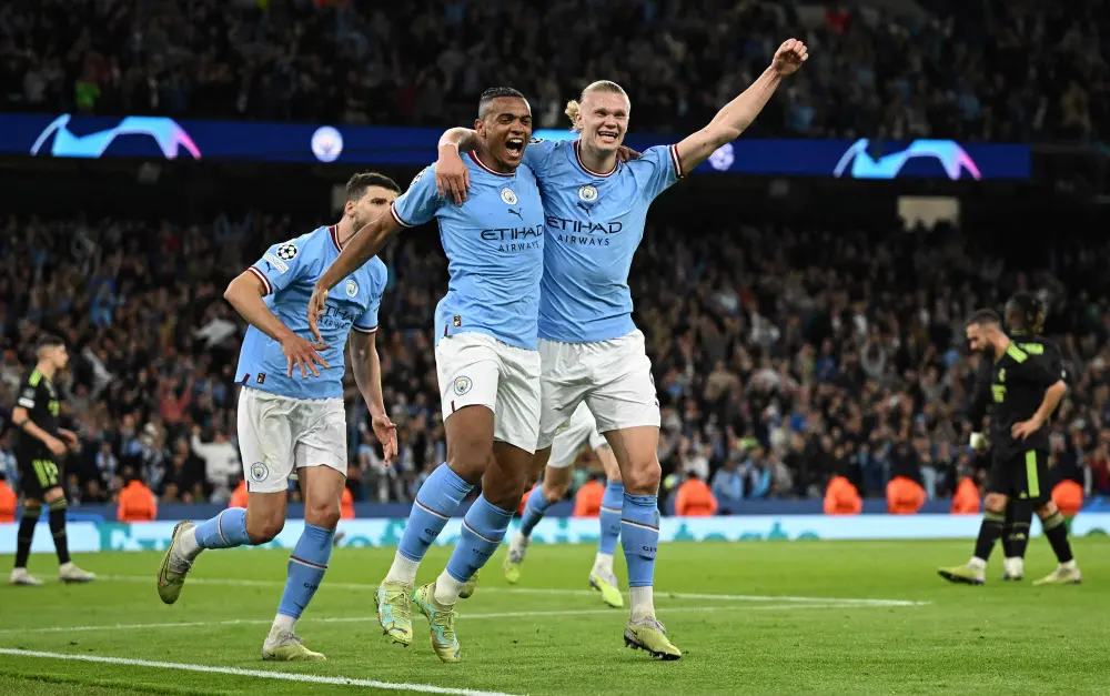 Manuel Akanji (L) celebrates scoring the team's third goal | AFP