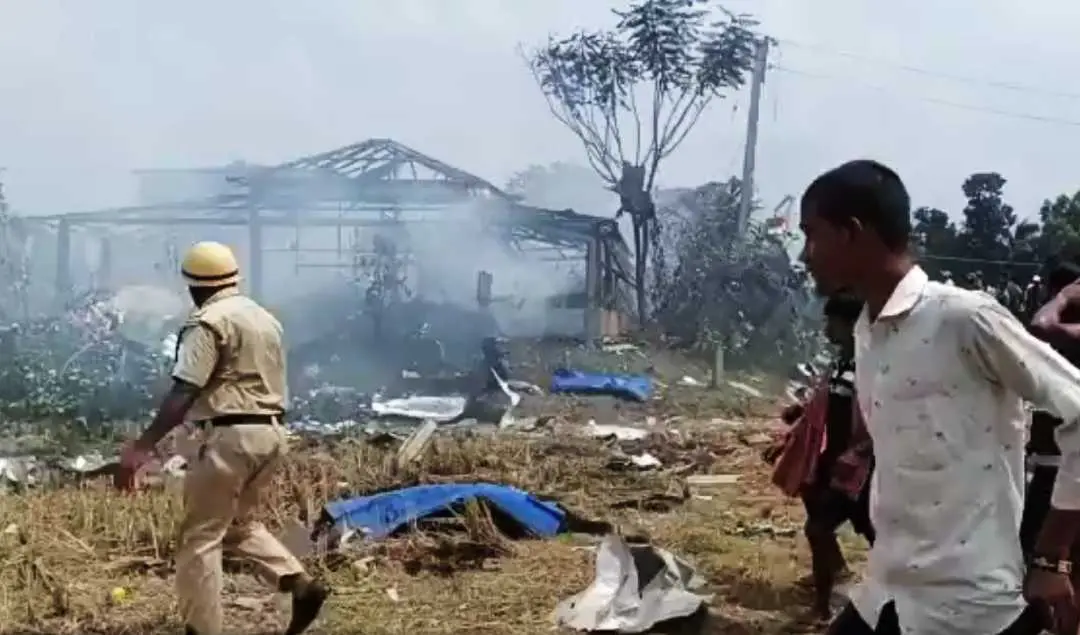Security personnel and locals outside an illegal firecracker unit after a massive explosion, in West Bengal's Purba Medinipur district on Tuesday, May 16, 2023. (PTI Photo)