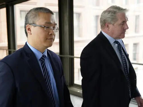 Former Minneapolis police officer Tou Thao, left, and his attorney Robert Paule arrive for sentencing for violating George Floyd's civil rights outside the Federal Courthouse, July 27, 2022, in St. Paul, Minn. Thao, who held back bystanders while his colleagues restrained a dying George Floyd, was found guilty on Monday, May 1, 2023 of aiding and abetting manslaughter | Photo: AP
