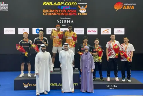 Chirag Shetty and Satwiksairaj Rankireddy (centre) pose for photos after winning the gold medal | PTI