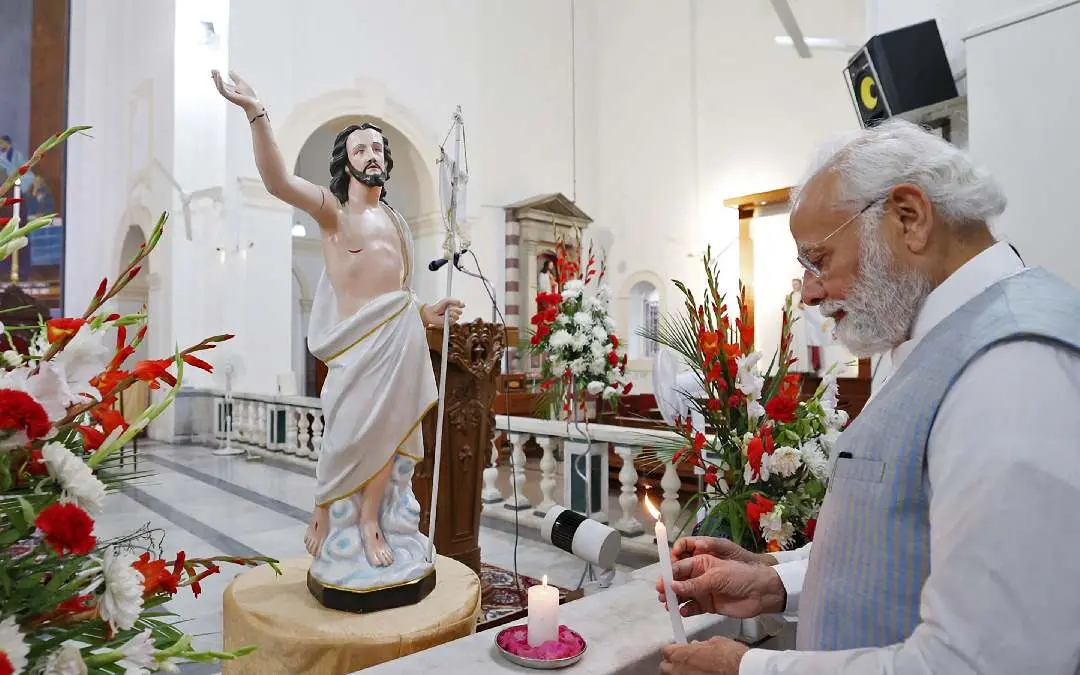 Prime minister Narendra Modi lighting a candle at the Sacred Heart Cathedral Catholic Church on Easter Sunday, in New Delhi on April 9, 2023 | Photo: PIB