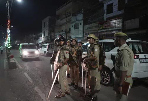 Policemen stand guard the area where gangster-turned-politician Atiq Ahmad and his brother Ashraf were shot | AP