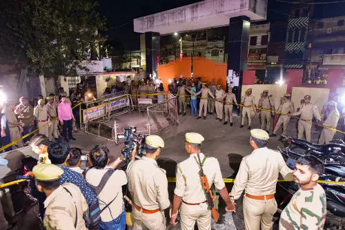 Police personnel at the site where Gangster-turned-politician Atiq Ahmed and his brother were shot dead | PTI