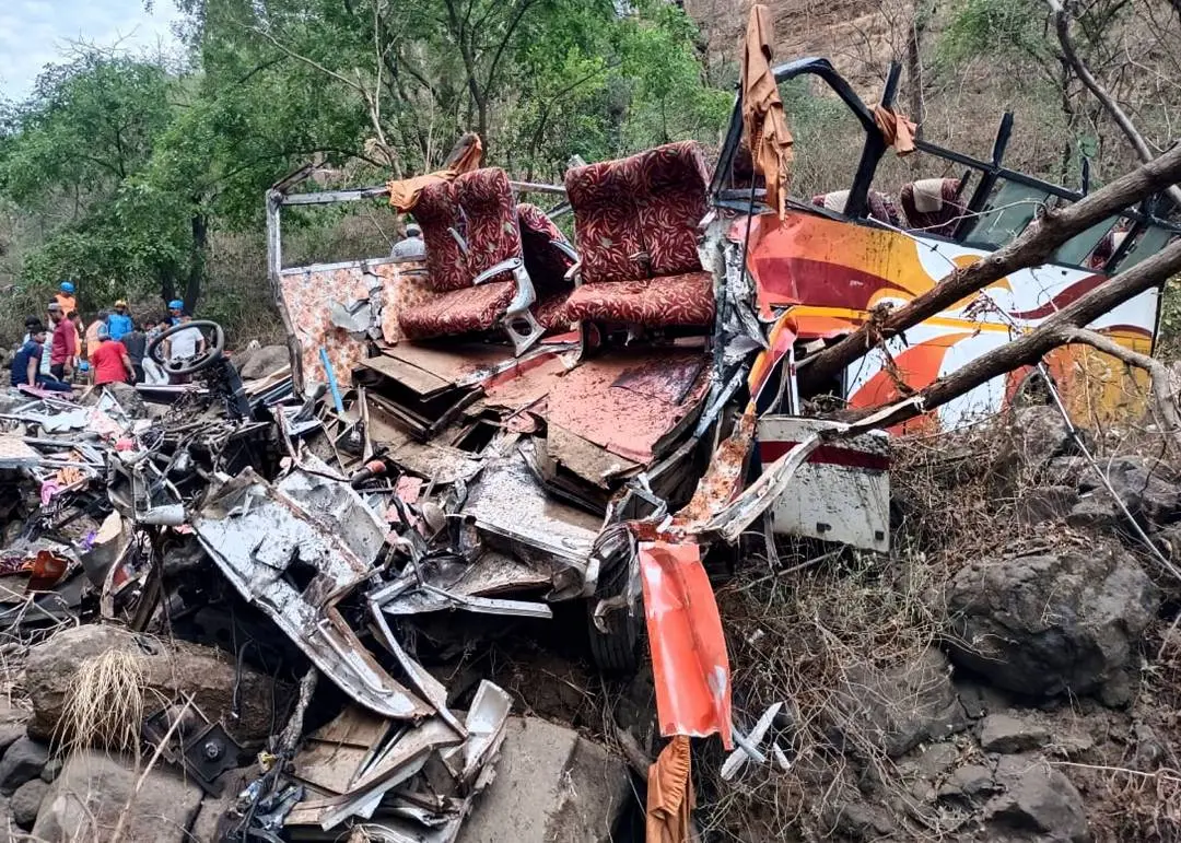 Police and rescue officials inspect the wreckage of a passenger bus near Khopoli, some 70 kilometres (43 miles) from Mumbai | AP