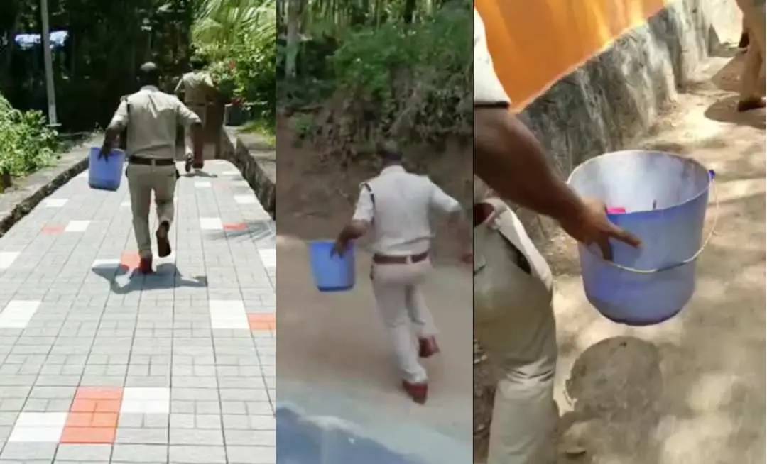 ബക്കറ്റിലുള്ള കുഞ്ഞിനേയും കൊണ്ട് ആശുപത്രിയിലേക്ക് കുതിക്കുന്ന പോലീസ് ഉദ്യോഗസ്ഥന്‍