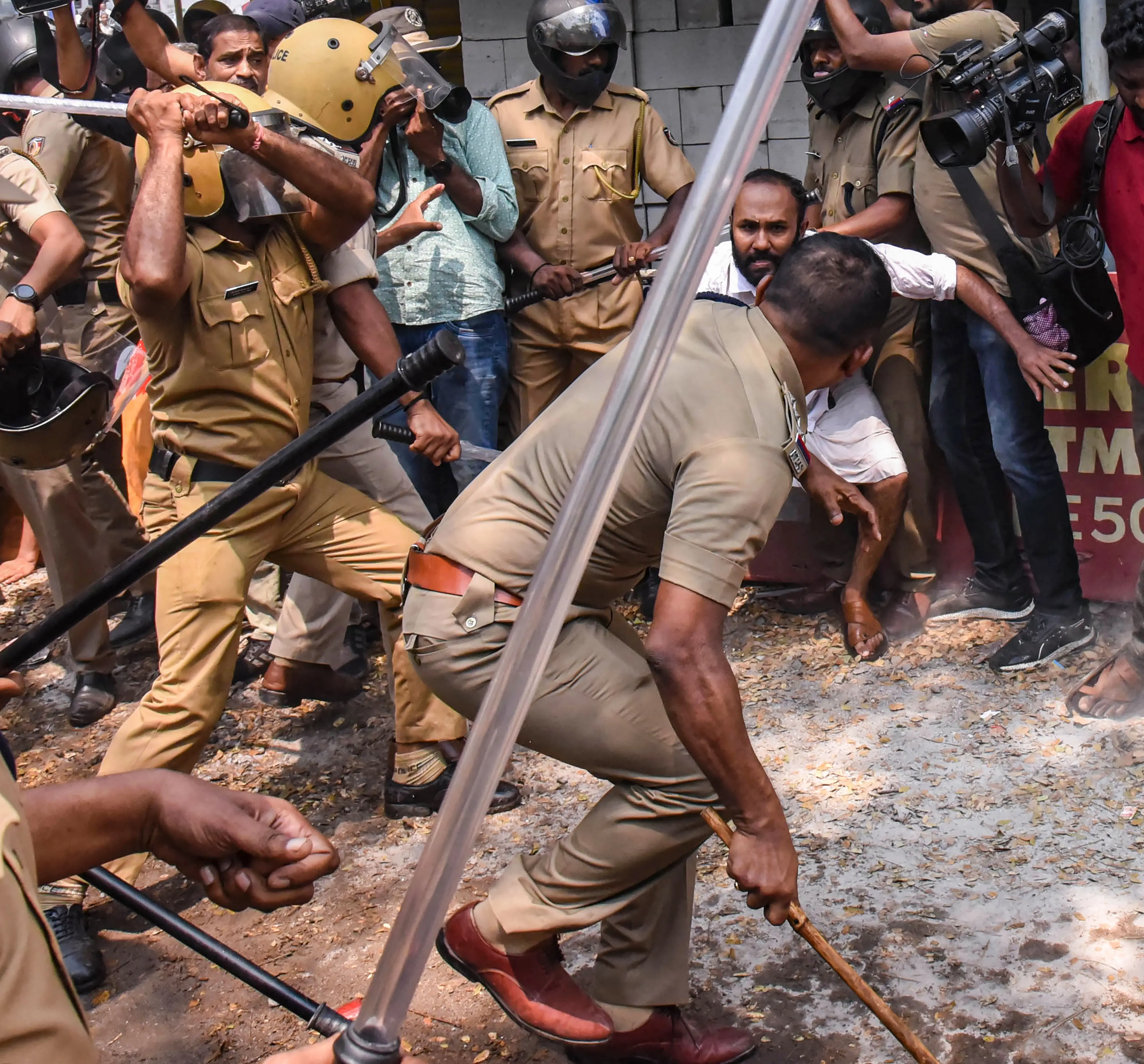 Police personnel lathi-charge on Youth Congress and KSU supporters during a protest march to the Kalamassery Police Station demanding action against the police officer who allegedly misbehaved with the KSU woman worker / Photo: PTI