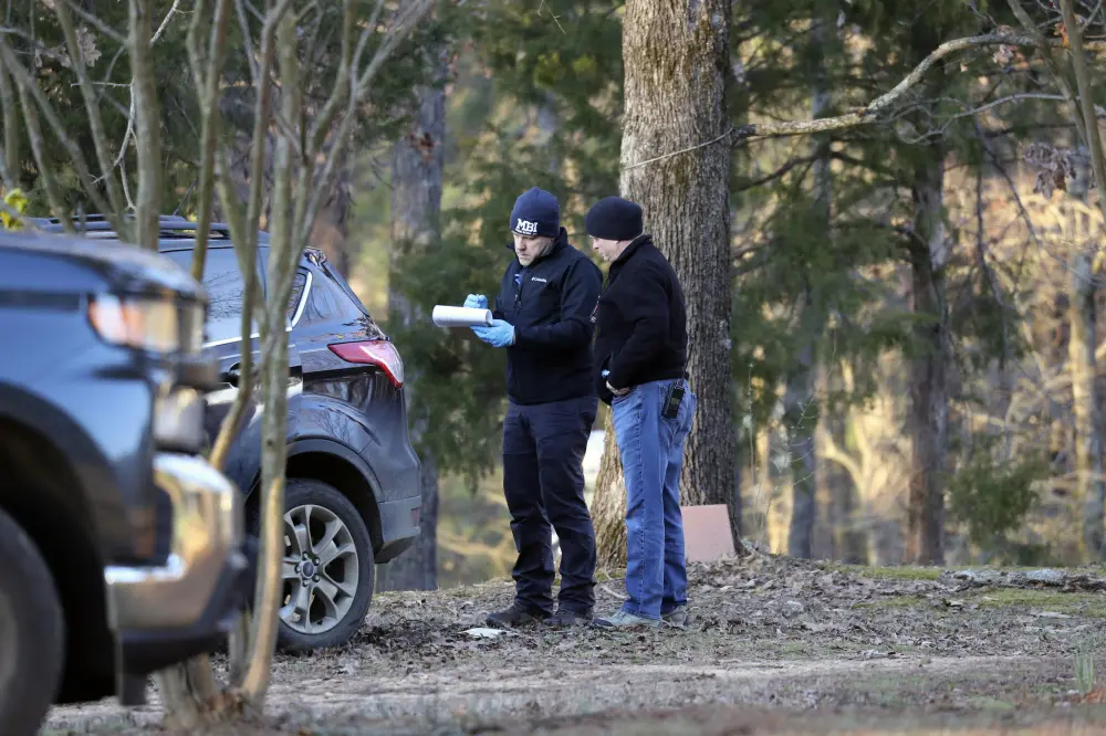 Law enforcement personnel investigate the scene of multiple shootings on Arkabutla Dam Road in Arkabutla| AP