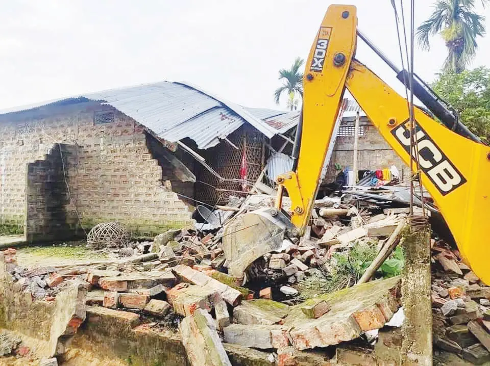 Police bulldozes house of suspects involved in torching police station in Assam