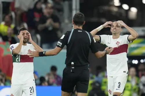 Ricardo Horta, left, and Portugal's Pepe gestures to referee Facundo Tello | AP